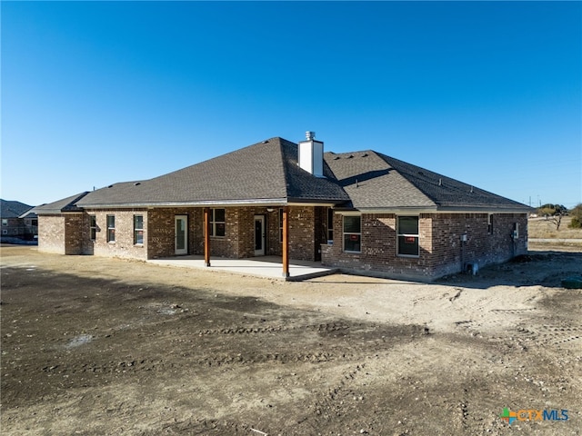 back of property featuring a patio area