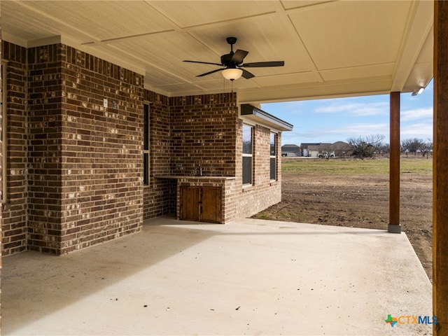 view of patio with ceiling fan