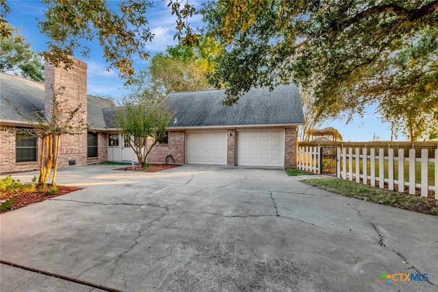 view of front of property featuring a garage