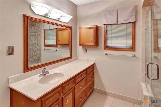 bathroom with tile patterned floors, vanity, and an enclosed shower