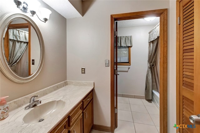 bathroom with tile patterned flooring, vanity, shower / bathtub combination with curtain, and a textured ceiling