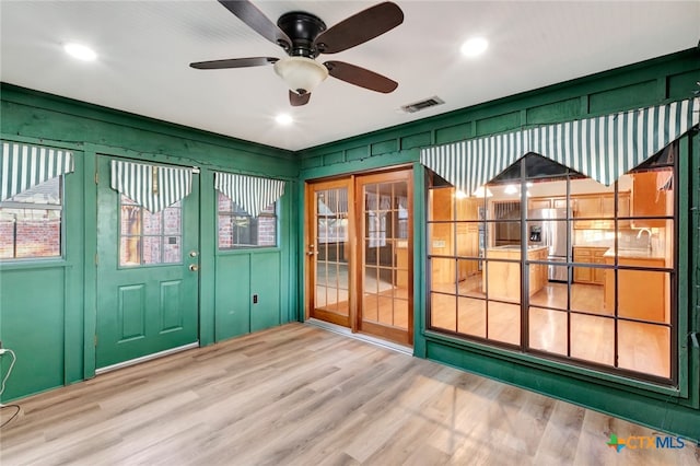 interior space with ceiling fan, a healthy amount of sunlight, and sink