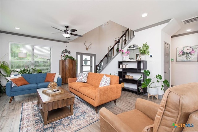 3810 Twilight Dr, Temple, TX 76502 - living area with wood finished floors, a ceiling fan, crown molding, stairway, and recessed lighting