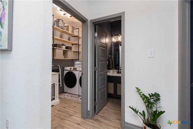3810 Twilight Dr, Temple, TX 76502 - laundry area with washer and clothes dryer and light wood-style flooring