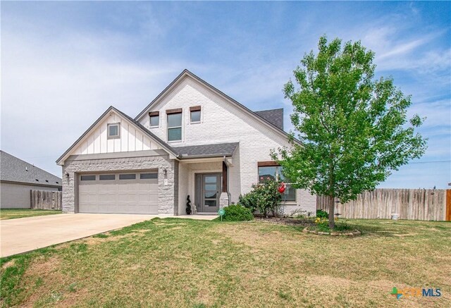 3810 Twilight Dr, Temple, TX 76502 - view of front of property with driveway, board and batten siding, and brick siding
