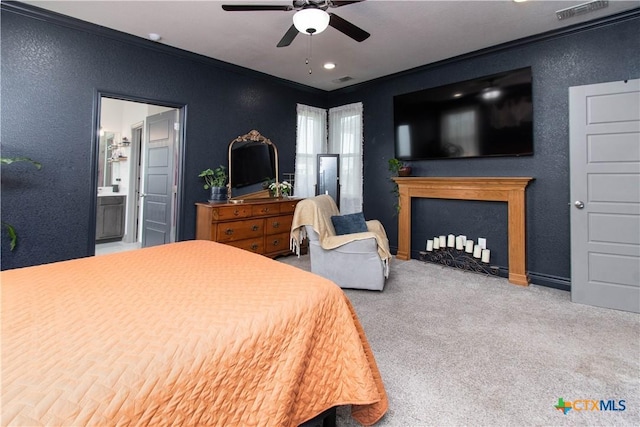 3810 Twilight Dr, Temple, TX 76502 - carpeted bedroom featuring crown molding, a fireplace with flush hearth, a textured wall, ensuite bath, and ceiling fan