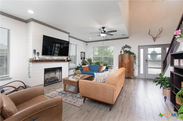3810 Twilight Dr, Temple, TX 76502 - living area featuring ceiling fan, wood finished floors, ornamental molding, a large fireplace, and recessed lighting