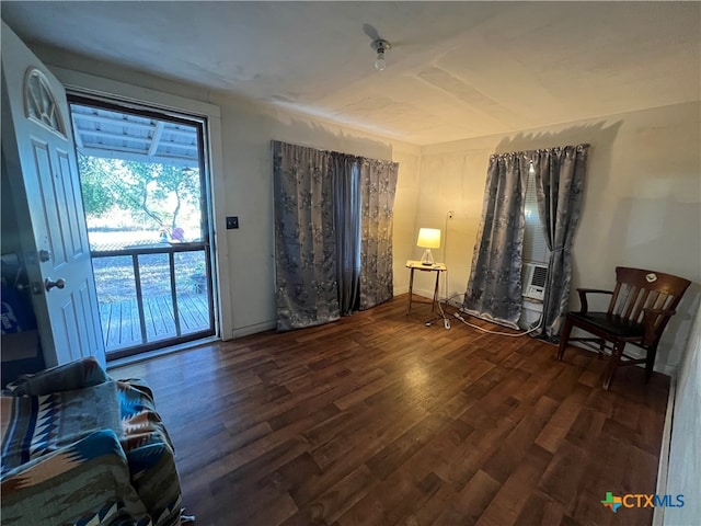 sitting room with dark hardwood / wood-style flooring