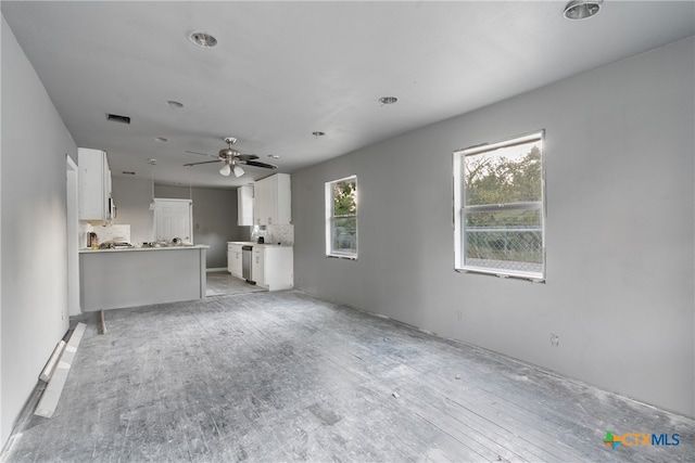 unfurnished living room with light hardwood / wood-style flooring and ceiling fan