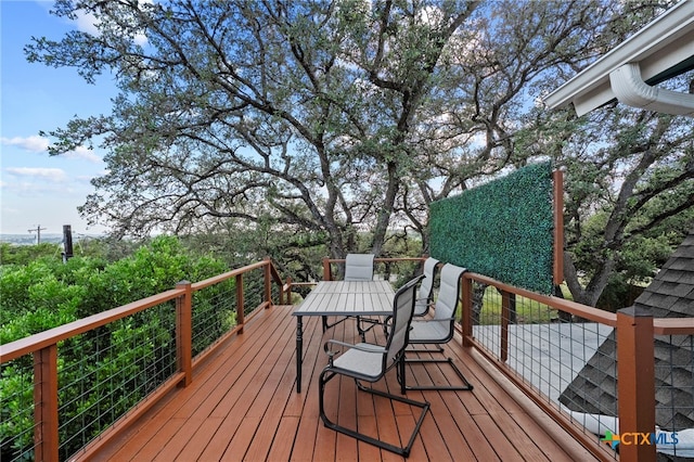 1400 Willow Dr, Canyon Lake, TX 78133 - wooden deck with outdoor dining area