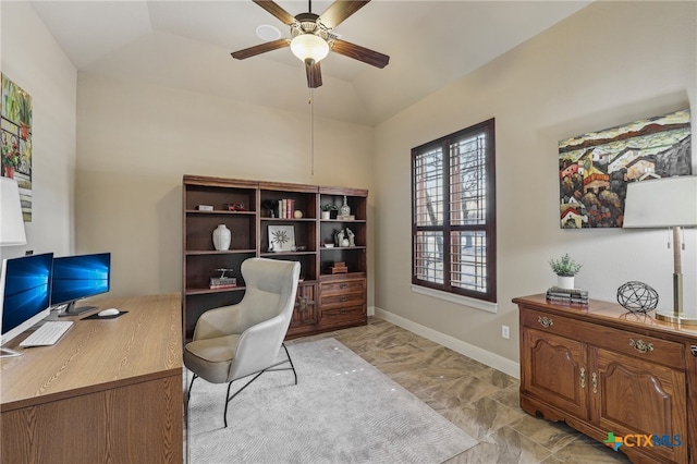 office space with a ceiling fan, vaulted ceiling, and baseboards