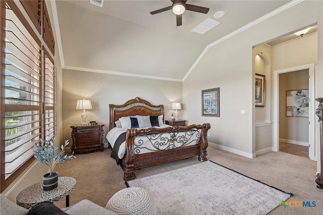 bedroom with carpet floors, ornamental molding, vaulted ceiling, ceiling fan, and baseboards