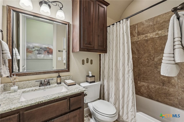 bathroom featuring toilet, shower / bathtub combination with curtain, vaulted ceiling, and vanity