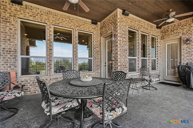 view of patio featuring outdoor dining space and a ceiling fan