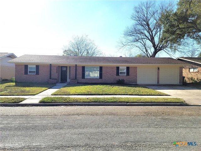 ranch-style house with a front lawn and a garage