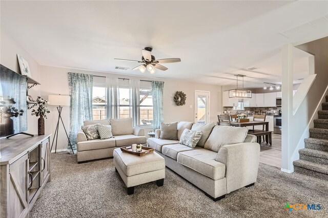 living room with ceiling fan