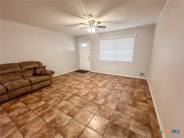 unfurnished living room featuring ceiling fan