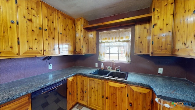 702 E Anaqua Ave, Victoria, TX 77901 - kitchen with black dishwasher, brown cabinets, and dark countertops