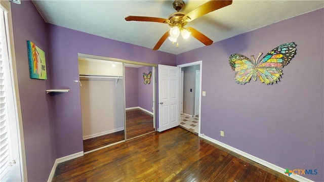 702 E Anaqua Ave, Victoria, TX 77901 - unfurnished bedroom with hardwood / wood-style floors, a closet, and a ceiling fan
