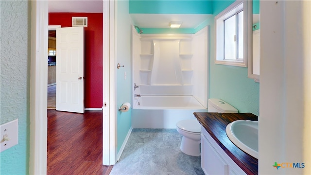 702 E Anaqua Ave, Victoria, TX 77901 - bathroom with vanity, wood finished floors, and shower / bath combination
