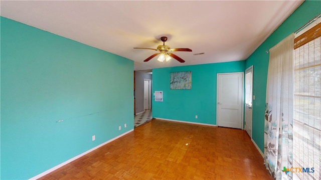 702 E Anaqua Ave, Victoria, TX 77901 - empty room featuring a ceiling fan and baseboards
