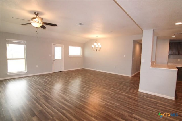 1027 County Road 274, Bertram, TX 78605 - unfurnished living room with baseboards, a chandelier, a ceiling fan, dark wood finished floors, and recessed lighting