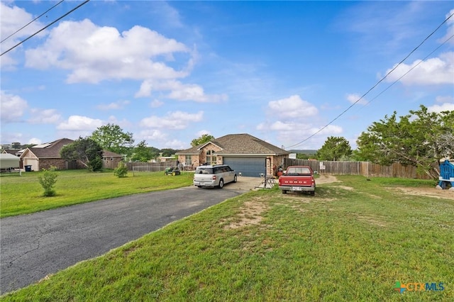 699 Irish Ln, Killeen, TX 76539 - view of front of home with driveway and a garage