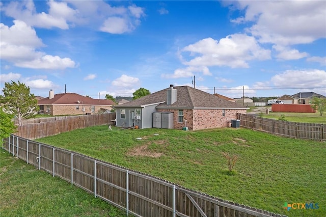 699 Irish Ln, Killeen, TX 76539 - rear view of house featuring central air condition unit and brick siding