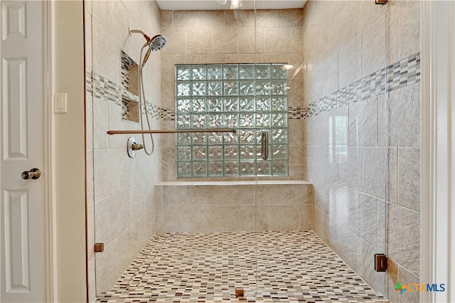 bathroom featuring an enclosed shower