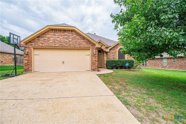 602 Dusty Trl, Belton, TX 76513 - ranch-style house featuring an attached garage, concrete driveway, brick siding, and a front yard