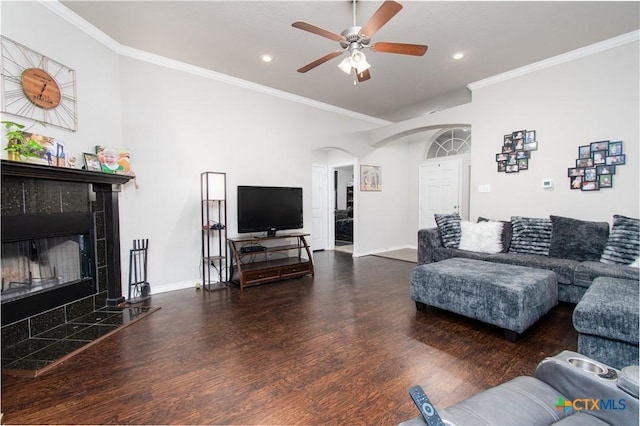 602 Dusty Trl, Belton, TX 76513 - living area featuring arched walkways, ceiling fan, wood finished floors, crown molding, and a tiled fireplace