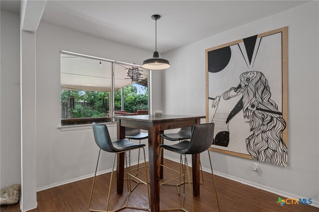 10207 Ray Ave, Austin, TX 78758 - dining room with wood finished floors and baseboards
