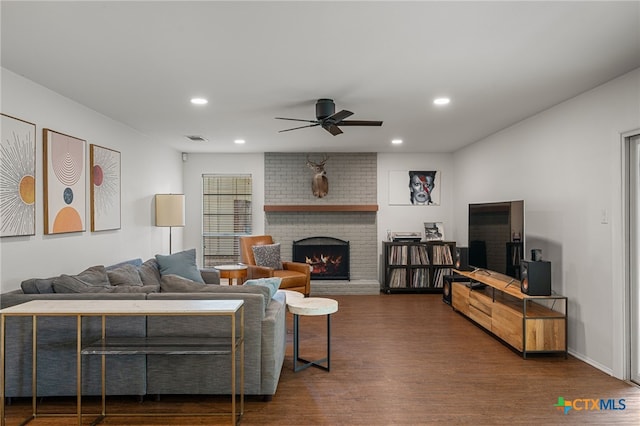 10207 Ray Ave, Austin, TX 78758 - living area featuring a ceiling fan, dark wood-style flooring, a brick fireplace, and recessed lighting