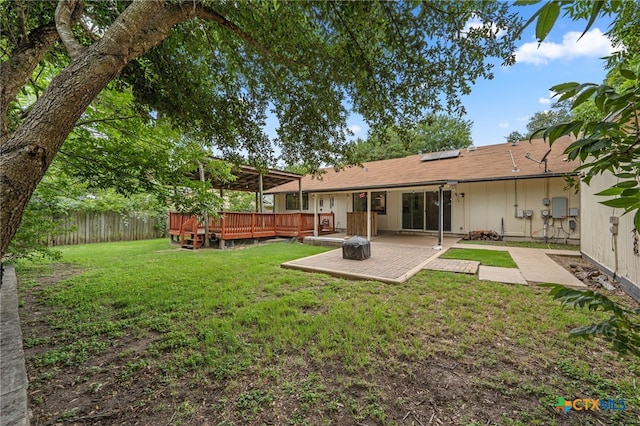 10207 Ray Ave, Austin, TX 78758 - view of yard featuring a patio and a wooden deck