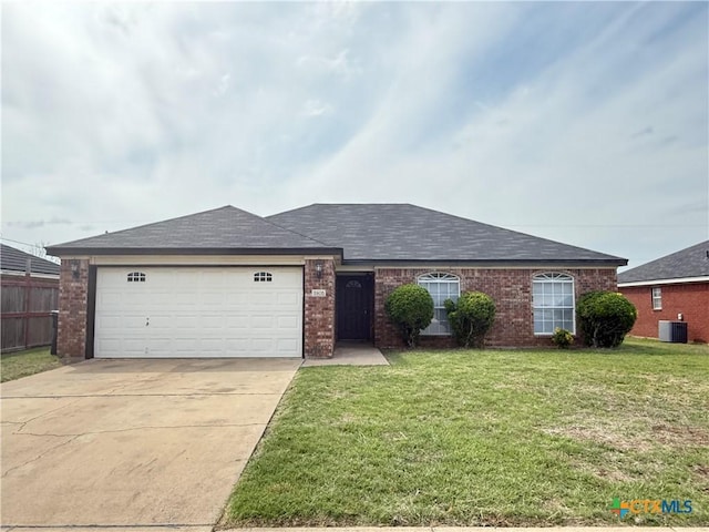 single story home featuring a front lawn, central air condition unit, concrete driveway, brick siding, and a garage