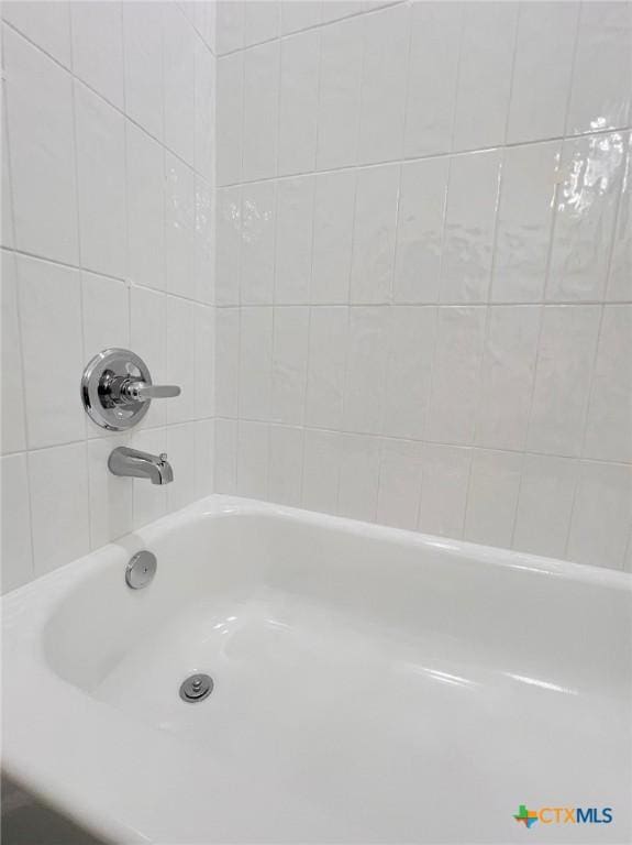 116 Raindance Ct, Victoria, TX 77904 - bathroom featuring washtub / shower combination