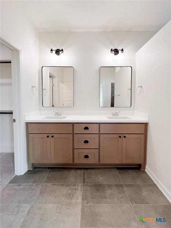 116 Raindance Ct, Victoria, TX 77904 - bathroom featuring double vanity and baseboards