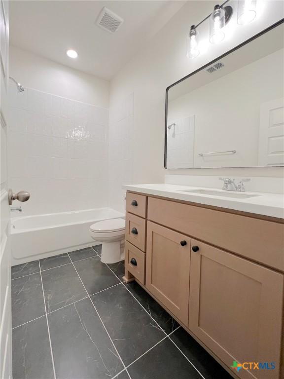 116 Raindance Ct, Victoria, TX 77904 - full bathroom with vanity, washtub / shower combination, tile patterned floors, and recessed lighting