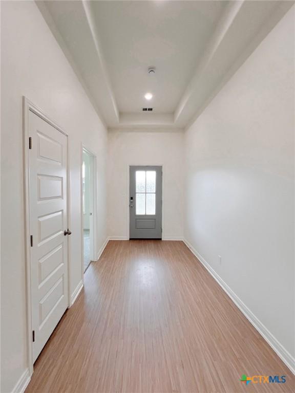 116 Raindance Ct, Victoria, TX 77904 - entryway featuring wood finished floors and a raised ceiling