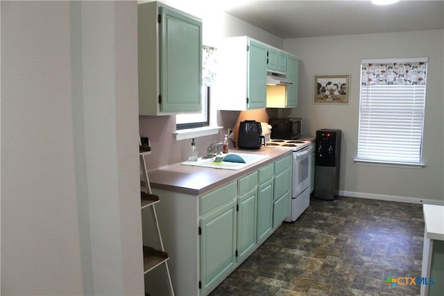 kitchen with white range with electric stovetop and sink