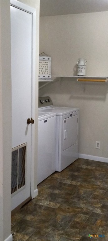 clothes washing area with independent washer and dryer