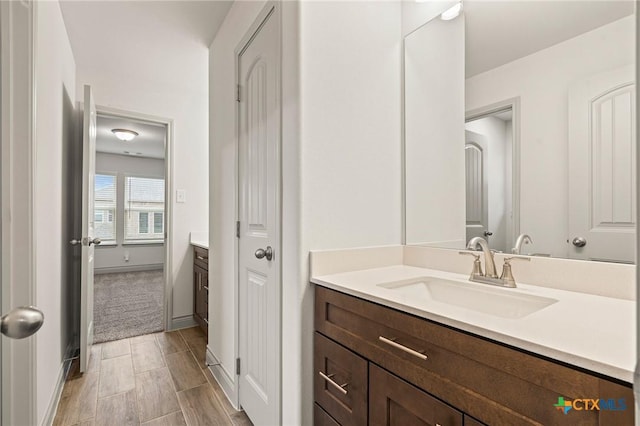 bathroom featuring hardwood / wood-style floors and vanity