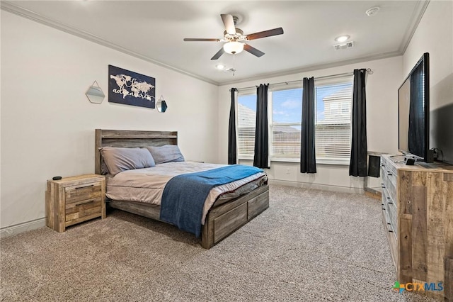 carpeted bedroom featuring ceiling fan and crown molding