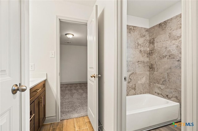 bathroom with vanity and wood-type flooring