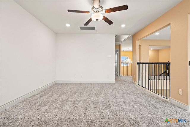 carpeted empty room with ceiling fan