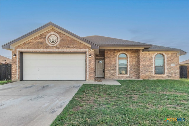 4603 Lauren Mackenzie Dr, Killeen, TX 76549 - ranch-style house featuring brick siding, concrete driveway, a garage, and a shingled roof