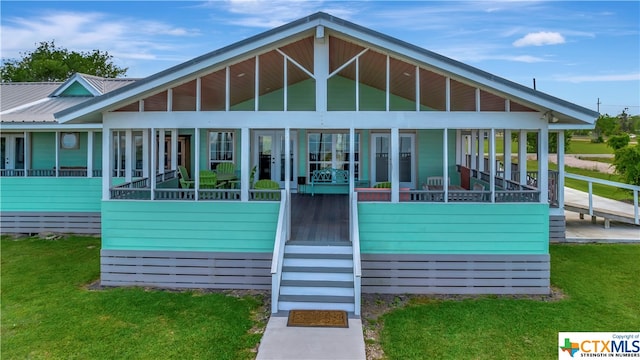 403 Bay St, Austwell, TX 77950 - exterior space with a lawn and a sunroom