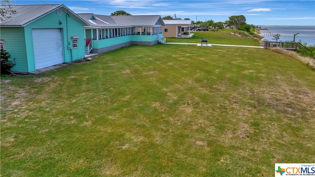 403 Bay St, Austwell, TX 77950 - view of yard with a garage and a water view