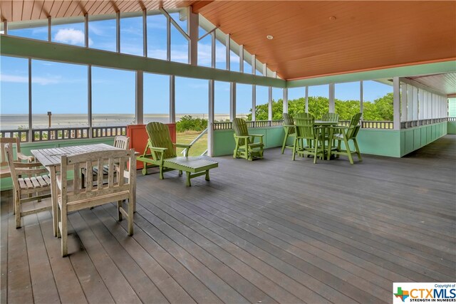 403 Bay St, Austwell, TX 77950 - sunroom with lofted ceiling with beams and a water view