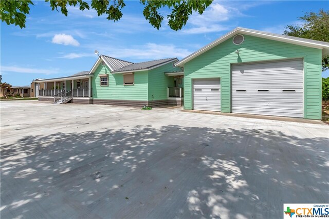 403 Bay St, Austwell, TX 77950 - single story home with a porch and a garage